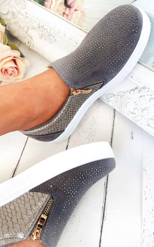 Grey slip-on trainers with rhinestone-dotted upper and croc-effect side panels, gold zip tab.