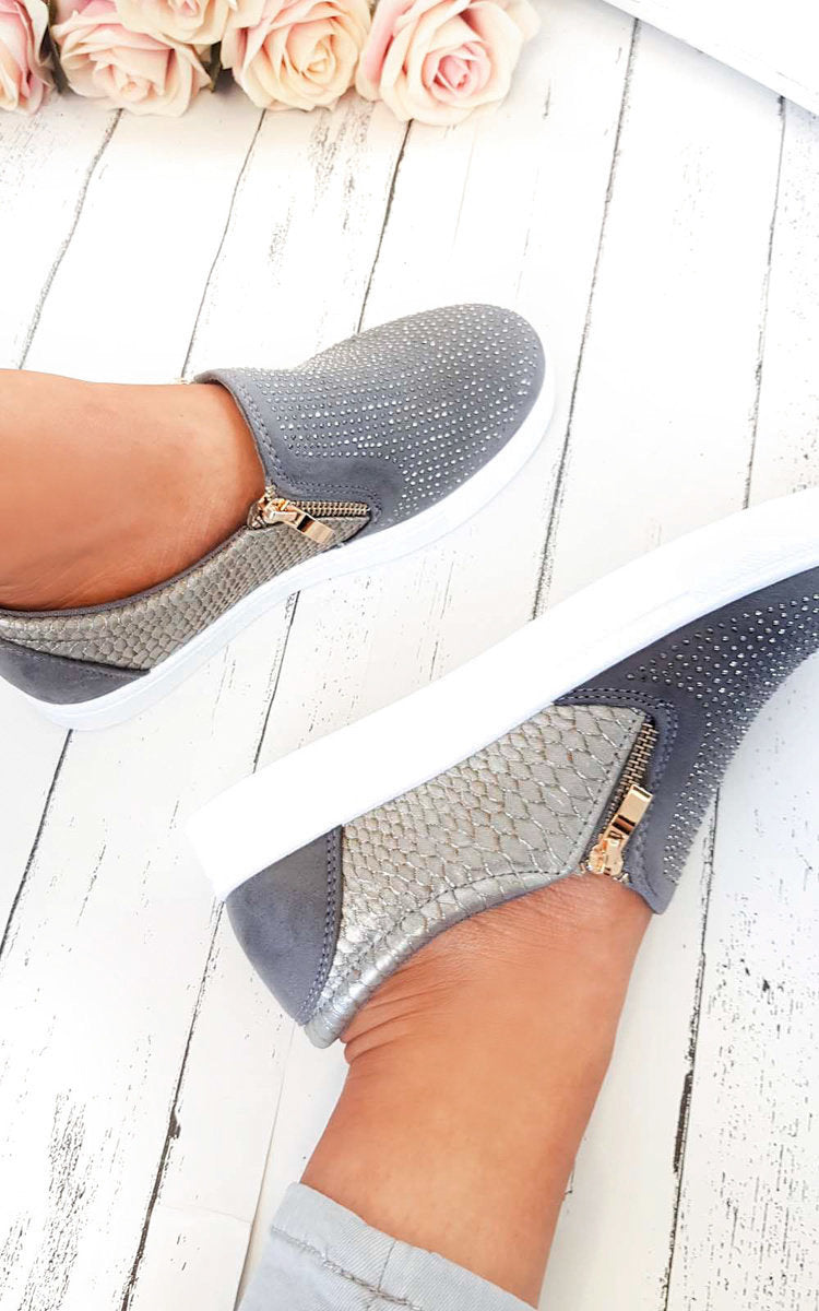 Grey slip-on trainer with rhinestone-dotted upper, croc-effect side panel, gold zip tab.