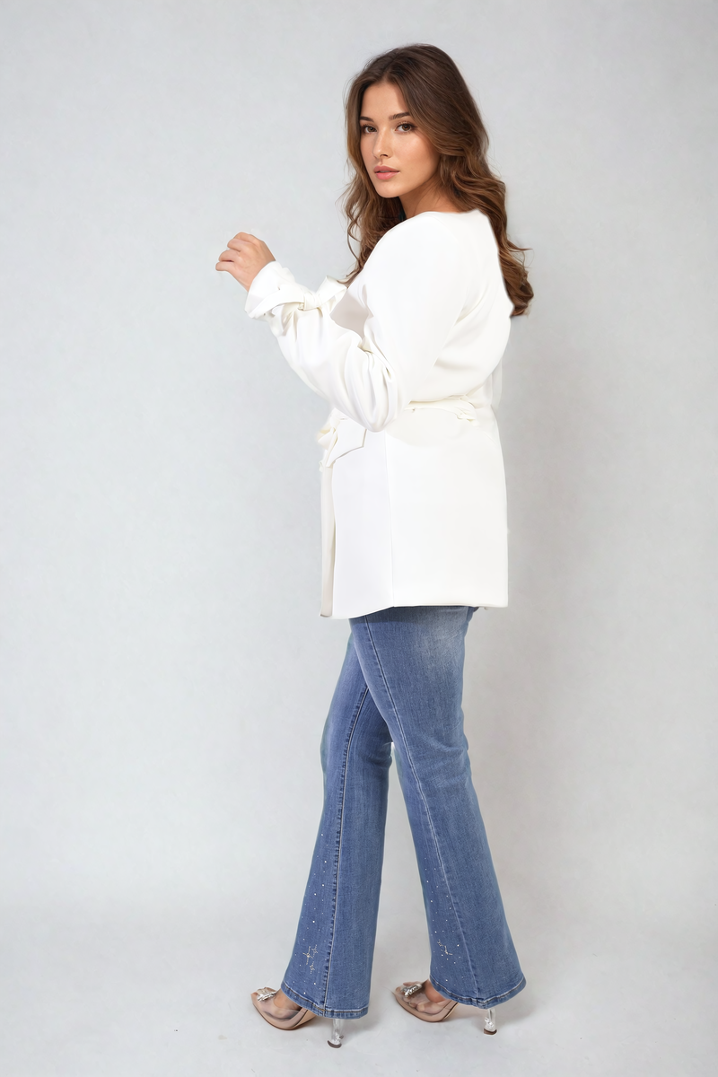 White belted blazer jacket side view with collared V-neck and tied waist
