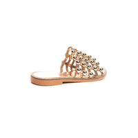 Nude flat slide sandals with studded lattice upper, low flat sole side view