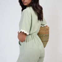 Sage green wrap playsuit with contrast scalloped trim and waist tie