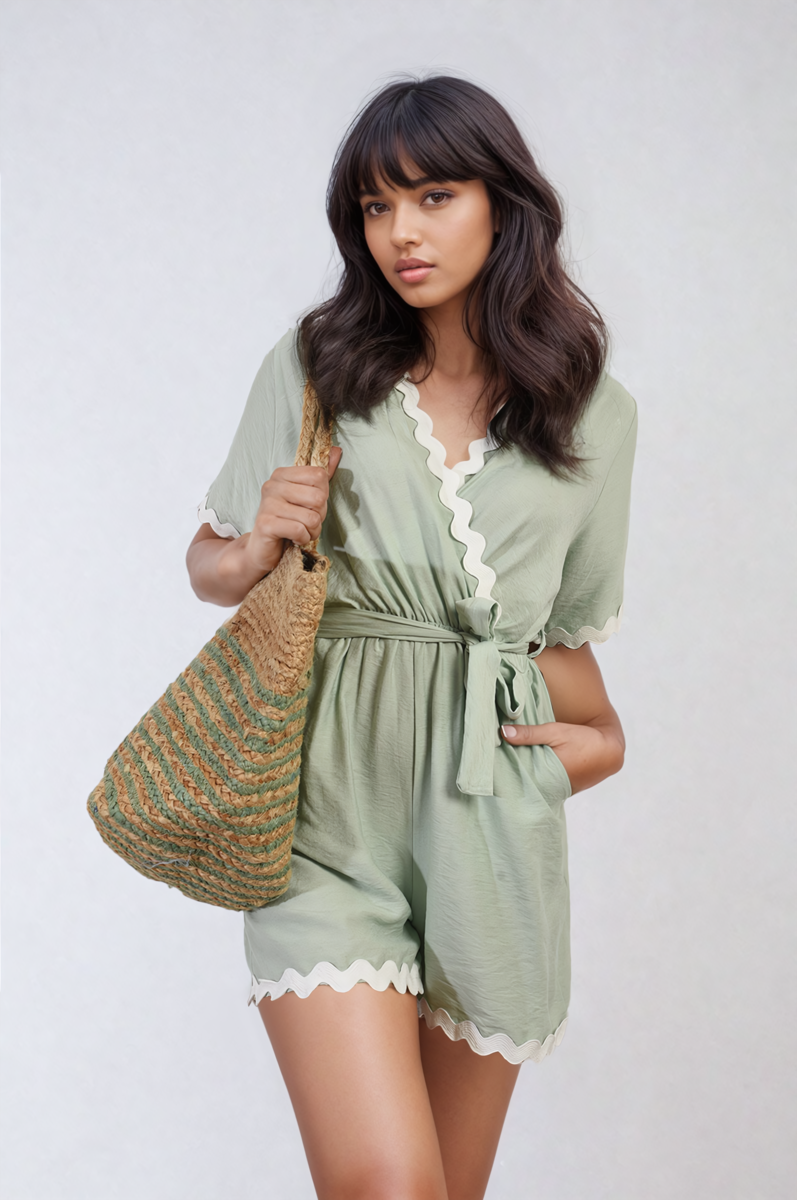 Light green wrap playsuit with white scalloped trim and waist tie, short sleeves