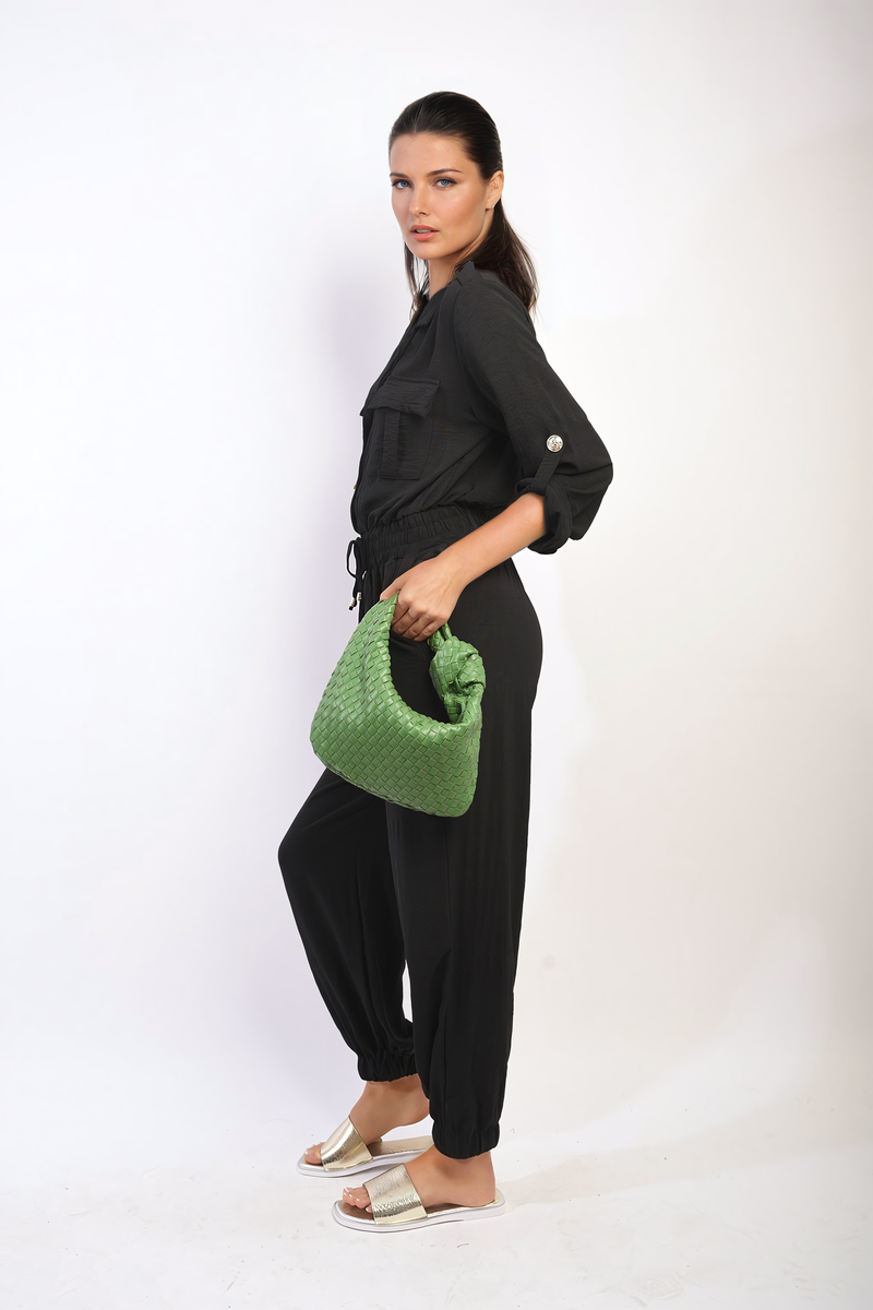 Black button-front collar jumpsuit with drawstring waist and gathered jogger pant legs.