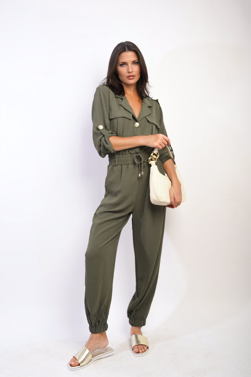 Olive green button-front collar jumpsuit with drawstring waist and relaxed jogger fit.