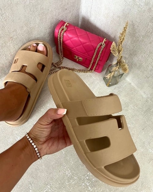 Beige slide sandals with geometric cutout straps, slip-on slide