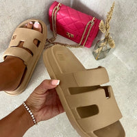Beige slide sandals with geometric cutout straps, slip-on slide