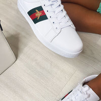 White trainers with colorful side panel, lace-up style and textured white sole