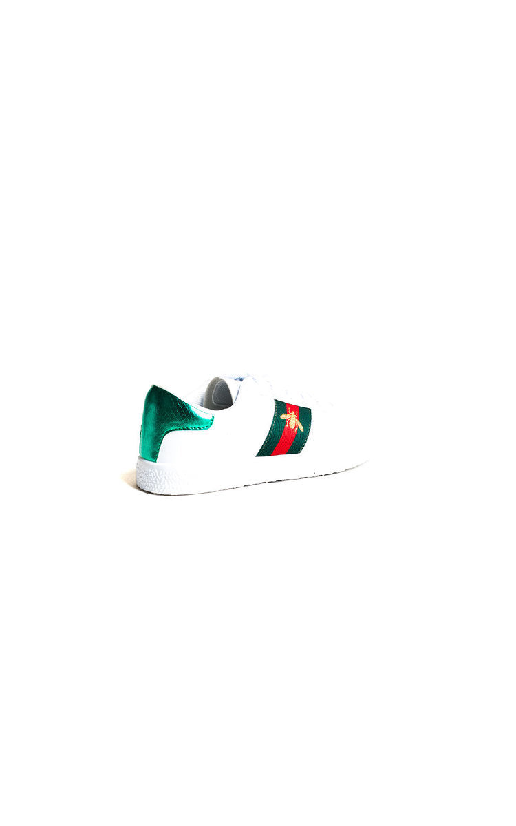 White trainers with green and red side panel detail on back half