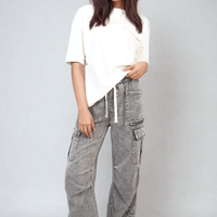 Grey cargo jeans with drawstring waist, patch cargo pockets, full front view