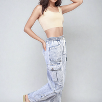 Light blue cargo jeans with drawstring waist and large patch pockets, standing pose