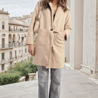 Textured button-front jacket with flap pockets, long sleeves, camel beige