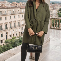 Olive textured button-up jacket with V-neck opening and flap front pockets