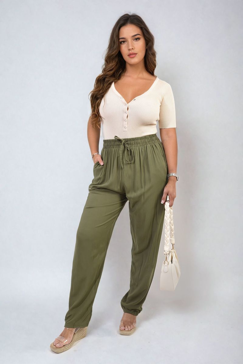 Olive-green high-waist drawstring trousers with side pockets and gathered waistband.