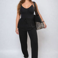 Black high-waist drawstring trousers with side pockets, relaxed straight-leg fit.