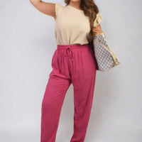 Fuchsia high-waist drawstring trousers with side pockets and loose straight legs