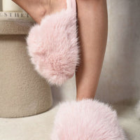 Pink fluffy faux-fur slide sandal with padded strap and open toe