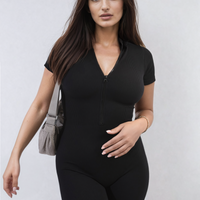 Rib knit zip-front short-sleeve playsuit in black, fitted short romper with zipper.