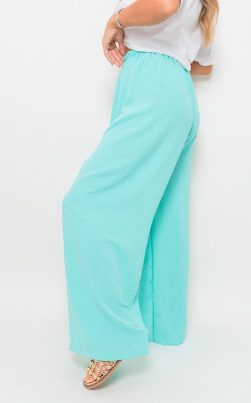 Mint wide-leg trousers with gathered drawstring waist, side view