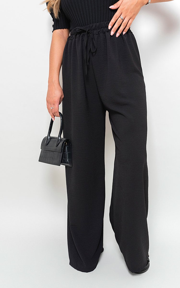 Black wide-leg trousers with gathered drawstring waist, front view