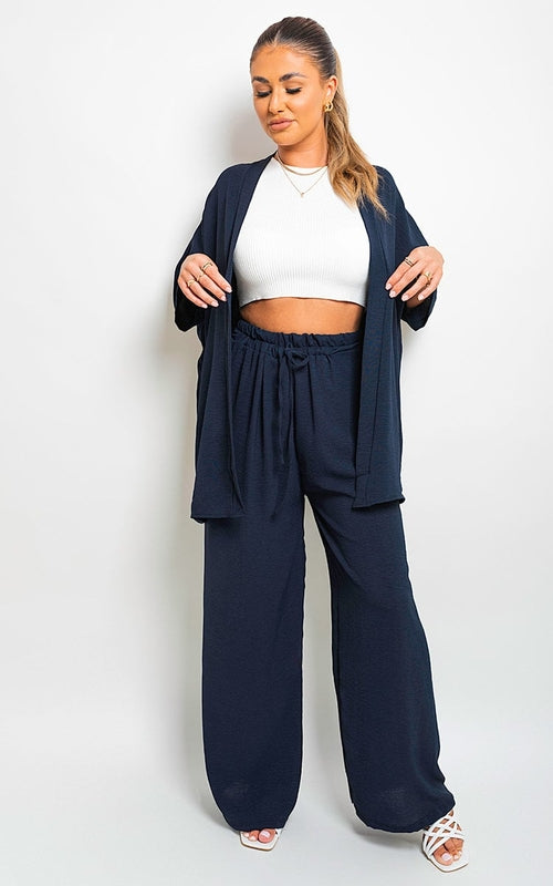 Navy wide-leg trousers with drawstring gathered waist and loose, flowing legs