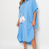 Light blue button-down collared midi dress with two front pockets and waist tie