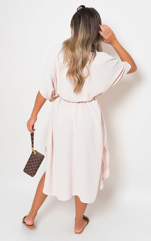 Off-white button-down collared midi dress with two front pockets and belt tie