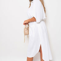 White button-down collared midi dress with two front pockets and waist tie belt