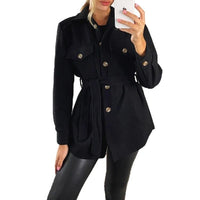 Dark navy belted jacket with gold snap buttons, flap pockets, and long sleeves.