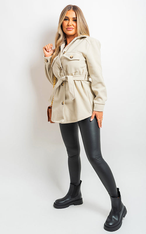 Beige belted jacket with button front, flap pockets, long sleeves