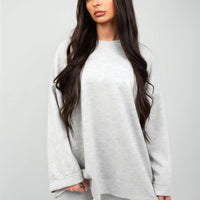 Light grey oversized crewneck sweatshirt with long sleeves, front view