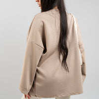 Beige oversized crewneck sweatshirt with long sleeves, back view