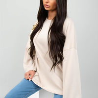 Off-white oversized crewneck sweatshirt with long sleeves, front view