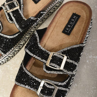 Embellished black platform sandals with two silver buckles and sparkle straps.