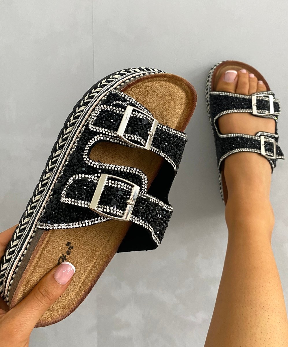Embellished black platform sandals with two square buckles and crystal straps.