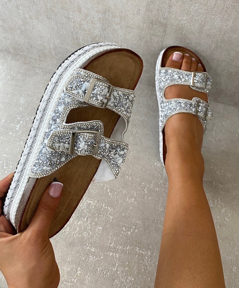 Embellished silver platform sandals with two square buckles and rhinestone straps.