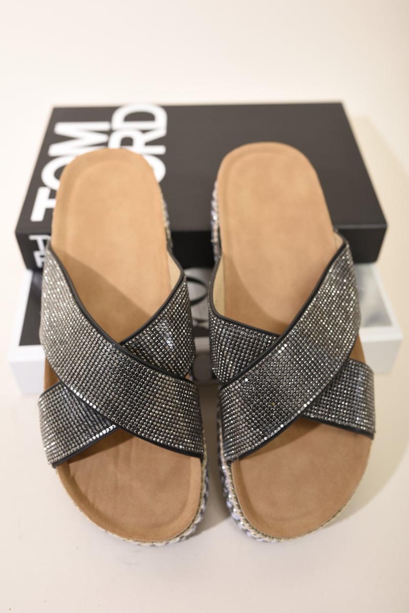 Pair of black diamante platform slide sandals with braided trim and crisscross straps