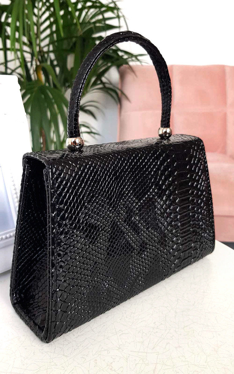 Faux Leather Handbag in Lilac with Top Handle and Chain Strap
