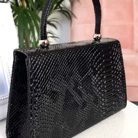 Faux Leather Handbag in Lilac with Top Handle and Chain Strap