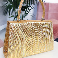 Faux Leather Handbag in Lilac with Top Handle and Chain Strap