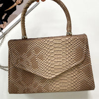 Faux Leather Handbag in Lilac with Top Handle and Chain Strap