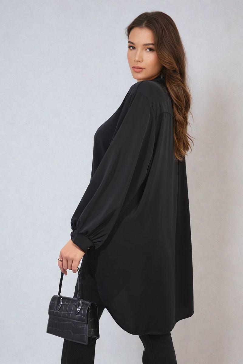 Black oversized collared button-down top with long sleeves and curved hem