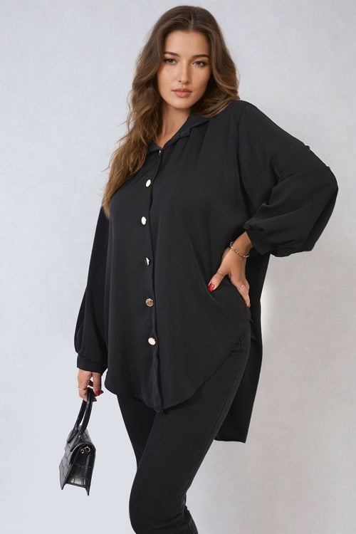 Oversized black button-down shirt with pointed collar and long puff sleeves, front buttons
