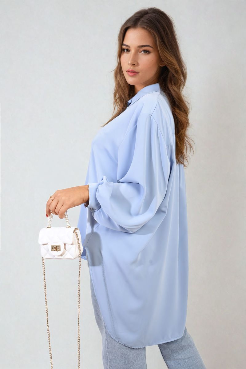 Light blue oversized collared button-down top, draped long sleeves, button placket
