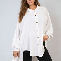 Oversized collared button-down shirt in white, long sleeves with button placket detail