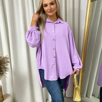 Oversized collared button-down shirt in lilac with long puff sleeves and button front