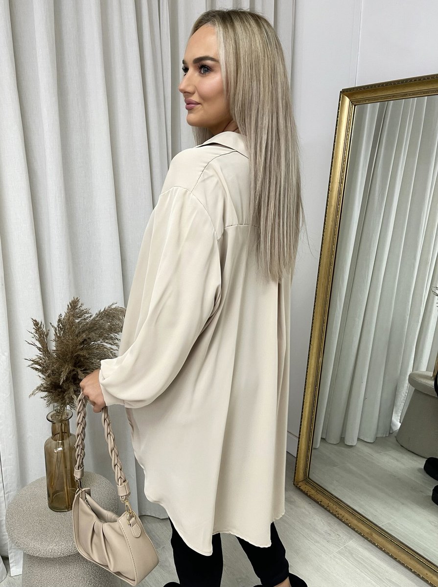 Beige collared button-down top with long sleeves, side drape, and back view