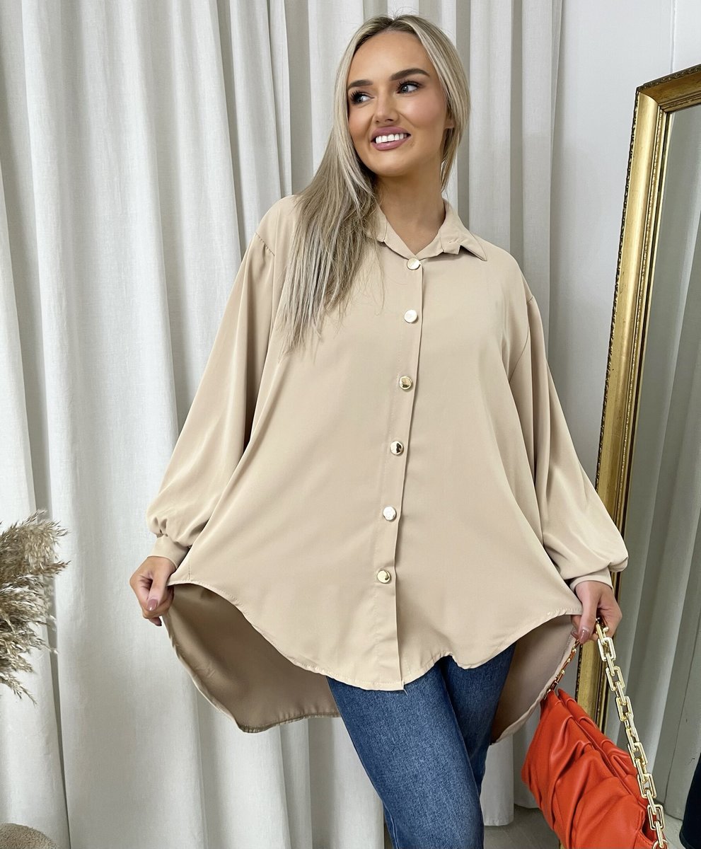 Oversized collared beige button-down shirt with long puff sleeves and rounded hemline