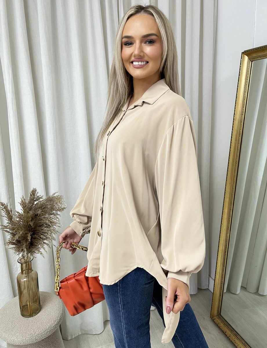 Oversized collared beige button-down top with long sleeves, button placket, curved hem