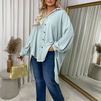 Light blue oversized collared button-down top with long sleeves and button placket