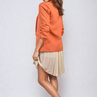 Orange open-front blazer jacket with ruched sleeves and front pockets, side view